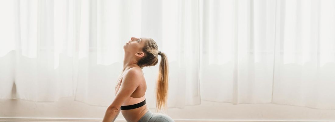 Panoramic view of a serene yoga studio with mats and props.
